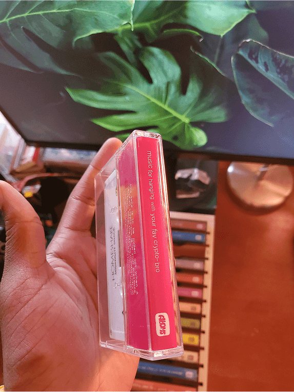 The crypto-bro case turned on its side, showing the spine title and the Alboms badge