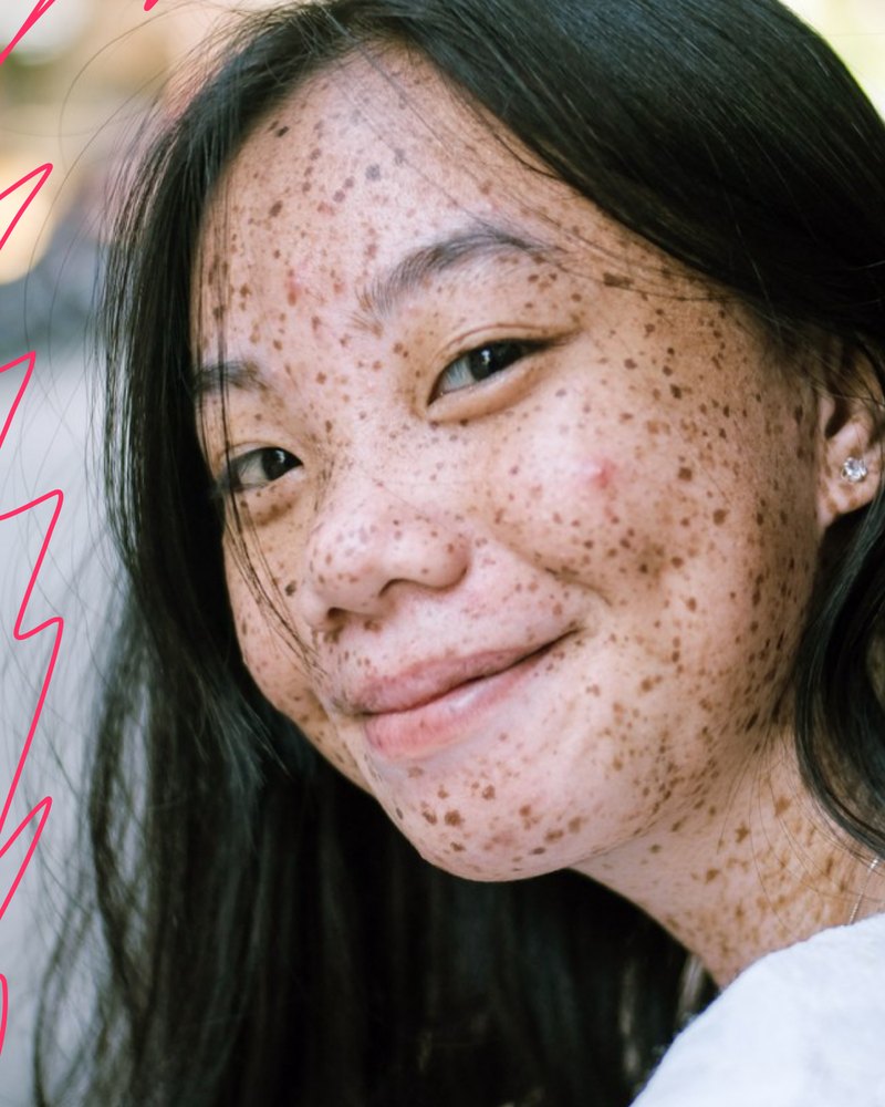 Janine Lin smiling over her shoulder, framed by pink zigzag scribbles